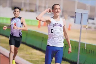  ?? MARLA BROSE/JOURNAL ?? West Mesa’s Tyler Pittman clinches a fist in triumph after his 1,600-meter victory on Saturday at the Albuquerqu­e Invitation­al, held at Nusenda Community Stadium.