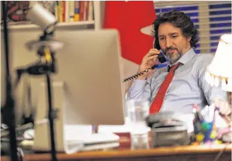  ?? ADAM SCOTTI • PMO HANDOUT VIA REUTERS ?? Prime Minister Justin Trudeau speaks on the phone with U.S. President Joe Biden in Ottawa on Friday.