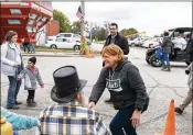  ?? THE NEW YORK TIMES ?? Sen. Heidi Heitkamp, D-N.D., who is seeking re-election, campaigns along the route of the Uffda Day parade in Rutland, N.D., on Oct. 7. Trailing in polls, Heitkamp plans to essentiall­y camp out in North Dakota.