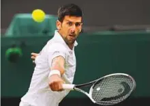  ?? AP ?? Novak Djokovic returns to Adrian Mannarino of France during their Men’s Singles Match at the Wimbledon Tennis Championsh­ips in London yesterday.