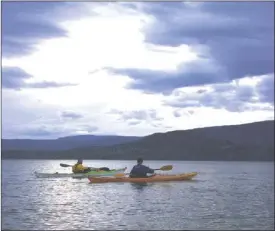  ?? J.P. SQUIRE/Special to The Okanagan Sunday ?? Members of the Kelowna Canoe and Kayak Club are back on the water. After a memorable and long winter, paddlers could hardly wait for the resumption of their outings on Okanagan Lake every Wednesday evening, above. Check their website (kckc.ca) for the...