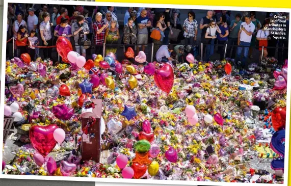  ??  ?? Crowds laid floral tributes in Manchester’s St Anne’s Square.