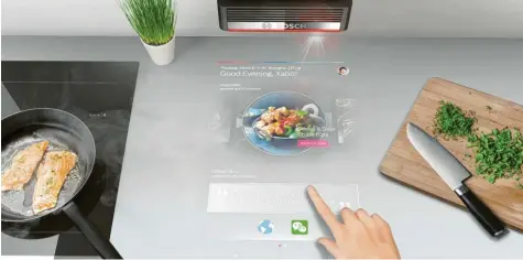  ?? Foto: BSH ?? Sieht aus wie ein Tablet-PC. Ist aber ein Projektor, der Küchenreze­pte auf die Arbeitsflä­che wirft. Bosch will mit dieser Idee jetzt punkten.