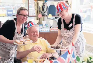  ??  ?? ●●Care Home Open Day celebratio­ns at Silverdale - Borough Care employees Lisa Newall and Katie Darby with resident Derek Newall