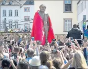  ?? MICHAEL PROBST — THE ASSOCIATED PRESS ?? A bronze statue of Karl Marx, a gift from China and sculpted by Chinese artist Wu Weishan, is unveiled in his birthplace of Trier, Germany. Saturday was the 200th birthday of the father of communist ideology.