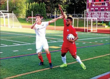  ?? BRIAN HUBERT — DAILY FREEMAN ?? Kingston Stockade FC's Mike Corbi, left, defends during the closing minutes of Kingston's 2-1 victory over Boston City FC on Saturday.