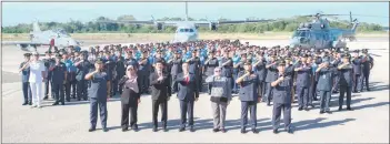  ?? — Bernama photo ?? Adly (front, fourth left) posing with air force personnel during his visit to Labuan on Saturday.