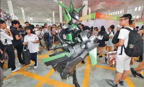  ?? CHINA NEWS SERVICE ?? A cosplay fan dressed in armor appears at the 2017 ChinaJoy Cosplay & Animation Festival (Hainan) in Haikou, capital of Hainan province, on Oct 1, 2017.