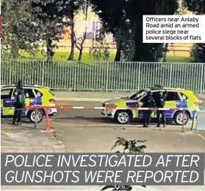  ??  ?? Officers near Anlaby Road amid an armed police siege near several blocks of flats