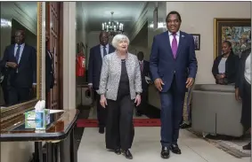  ?? (AP/Salim Dawood) ?? U.S. Treasury Secretary Janet Yellen walks with Zambia’s President Hakainde Hichilema during their meeting Monday at the state house in Lusaka, Zambia.