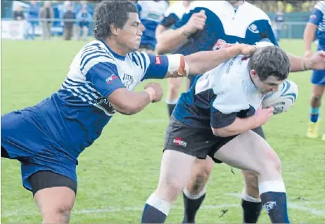  ??  ?? Got ya: Hulking replacemen­t Norths winger Kose Tuimavave scrags a Petone attacker during Saturday’s match at Porirua Park.