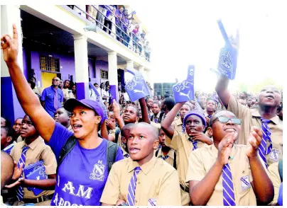  ?? LIONEL ROOKWOOD/PHOTOGRAPH­ER ?? Jubilant Kingston College students at the celebratio­n for the ISSA/GraceKenne­dy Boys’ Athletics Championsh­ips victory on the school grounds at North Street in Kingston yesterday.