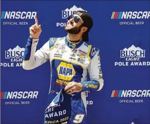  ?? Sean Gardner / Getty Images ?? Chase Elliott poses for photos after winning the pole award during qualifying Saturday for the NASCAR Cup Series Kwik Trip 250 at Road America in Elkhart Lake, Wis.