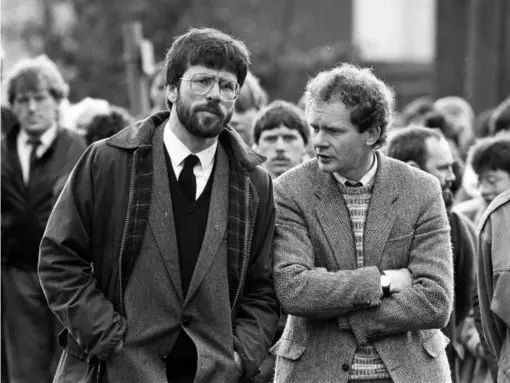  ??  ?? President of Sinn Fein, Gerry Adams, with McGuinness at the funeral in May 1987 of Patrick Kelly, the reputed IRA commander in East Tyrone (PA)