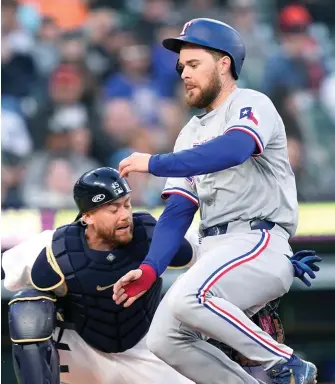  ?? (AP photo/carlos Osorio) ?? Texas Rangers' Jared Walsh is tagged out by Detroit Tigers catcher Carson Kelly on Monday during a baseball game in Detroit.