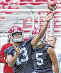  ?? Vasha Hunt The Associated Press ?? Oregon’s Justin Herbert, left, and Alabama’s Tua Tagovailoa are two of the top three quarterbac­ks in this month’s NFL draft that the Raiders might be looking at by trading away both of their first-round selections (Nos. 12 and 19). Or will they provide complement­ary talent for incumbent Derek Carr?