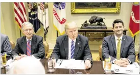  ?? AL DRAGO / THE NEW YORK TIMES ?? President Donald Trump, flanked by Senate Majority Leader Mitch McConnell of Kentucky (left) and House Speaker Paul Ryan of Wisconsin, presides Wednesday at a lunch meeting with congressio­nal Republican­s in the Roosevelt Room of the White House to...