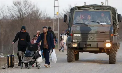  ??  ?? A Turkish military truck with refugees near the Pazarkule border crossing to Greece, March 2020. Photograph: Darko Bandić/AP