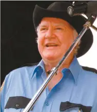  ?? AP Photo/Bristol Herald Courier by Earl Neikirk ?? In this June 4, 2005, “Dukes of Hazzard” cast member James Best sings during the DukesFest 2005 at the Bristol Motor Speedway in Bristol, Tenn. Best, the prolific actor best known for his role as Sheriff Rosco P. Coltrane on the series died Monday,...