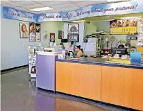  ??  ?? The Moto Photo lobby is where customers place orders and pick up products at 6900 N May Ave.