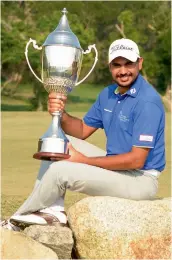  ??  ?? Gaganjeet Bhullar poses with the trophy after winning the Macau Open on Sunday.