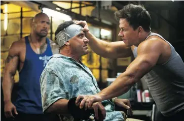  ?? PARAMOUNT PICTURES ?? Dwayne Johnson, left, Tony Shalhoub and Mark Wahlberg star in the movie Pain & Gain, released in April.