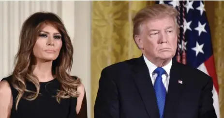  ?? OLIVIER DOULIERY/TRIBUNE NEWS SERVICE ?? As evidenced by Melania and Donald Trump, in the world of smiles, everything new is sullen again, Shinan Govani writes.