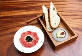  ?? photos: GLENN Guan/the Star ?? the cool and refreshing salame of the day (left) and sourdough bread with cultured butter with a drizzle of gula melaka and sea salt.