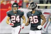  ?? KEVIN C. COX/GETTY IMAGES ?? Devonta Freeman, left, runs and Tevin Coleman provide the Atlanta Falcons with nearly indentical skill sets.