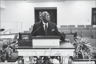  ??  ?? The Rev. Kenneth Lyons stands in the sanctuary of Greater New Bethel Baptist Church in Jasper. Lyons, who was the Byrd family’s pastor at the time of the killing, has traveled the nation to speak about hate crimes.