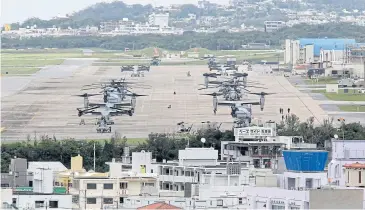  ?? EPA-EFE ?? US Marine Corps MV-22 Osprey aircraft sit on the tarmac at US Marine Corps Air Station Futenma on Okinawa island, Japan.