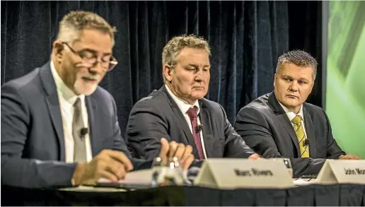  ?? JASON DORDAY/STUFF ?? In its 17-year history, Fonterra has never experience­d an annual loss before. Delivering the bad news at yesterday’s results presentati­on are, from left, chief financial officer Marc Rivers, chairman John Monaghan, and chief executive Miles Hurrell.