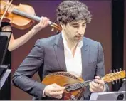  ?? Ben Gibbs ?? ISRAELI mandolinis­t Avi Avital performs with the Knights ensemble in Santa Monica on Wednesday.