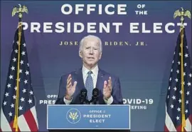  ?? Carolyn Kaster Associated Press ?? PRESIDENT- ELECT Joe Biden is preparing to take off ice with bare- bones cooperatio­n that normally would f low freely during the transfer of power.