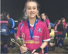  ??  ?? Robina City football player Paige Tooth, 14.