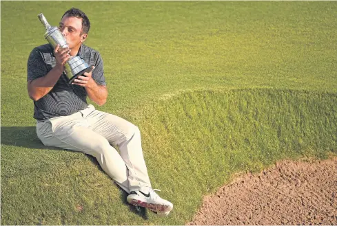  ?? AFP ?? Italy’s Francesco Molinari kisses the Claret Jug after winning the British Open at Carnoustie on Sunday.