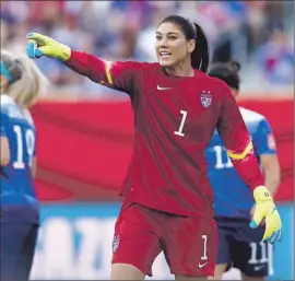  ?? Wang Lili
Xinhua / Sipa ?? GOALKEEPER Hope Solo, shown during a match against Sweden during the group stage, has set a U. S. record of 423 scoreless minutes in a World Cup.