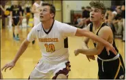  ?? RANDY MEYERS — FOR THE MORNING JOURNAL ?? Avon Lake’s Nate Sidloski and Bryce Neumann of North Ridgeville compete for a rebound during the third quarter on Feb. 26.