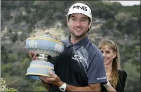  ?? ERIC GAY — THE ASSOCIATED PRESS ?? Bubba Watson holds his trophy after winning the during the final round at the Dell Technologi­es Match Play golf tournament Sunday in Austin, Texas. Watson defeated Kevin Kisner.