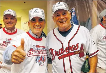  ?? CURTIS COMPTON / CCOMPTON@ AJC.COM ?? ▲ John Schuerholz gives the thumbs up with manager Bobby Cox in 2004 at Turner Field during the celebratio­n of the Braves’ 13th of 14 consecutiv­e division championsh­ips. Schuerholz built World Series winners with Kansas City and Atlanta.