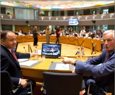  ?? AP Photo/VIrgInIA MAyo ?? EU chief Brexit negotiator Michel Barnier (right) speaks with Poland’s European Affairs Minister Konrad Szymansk (left) during a General Affairs Article 50 Council at the Europa building in Brussels, on Tuesday.