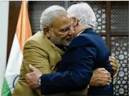  ?? NASSER NASSER / ASSOCIATED PRESS ?? Palestinia­n President Mahmoud Abbas (right) hugs Indian Prime Minister Narendra Modi after decorating him with the Grand Collar of the State of Palestine medal during Modi’s visit to Ramallah on Saturday.