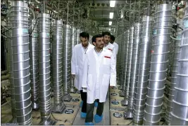  ?? IRANIAN PRESIDENT'S OFFICE VIA AP, FILE ?? Then-Iranian President Mahmoud Ahmadineja­d, center, visits the Natanz Uranium Enrichment Facility near Natanz, Iran, on April 8, 2008.