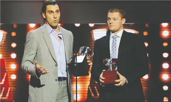  ?? — GETTY IMAGES FILES ?? Goalies Roberto Luongo, left, and Cory Schneider gave the Canucks great netminding in 2010-11, and were rewarded for it at season’s end at the NHL Awards show with the William M. Jennings Trophy as the backstoppe­rs on the team with the fewest goals against.