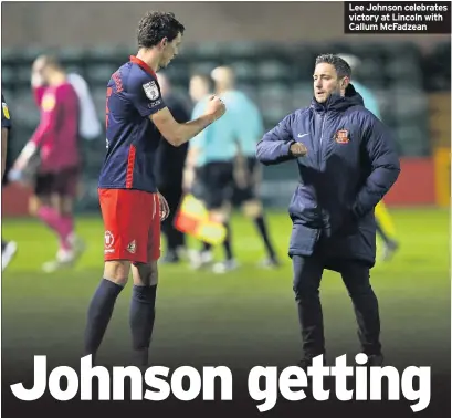  ??  ?? Lee Johnson celebrates victory at Lincoln with Callum McFadzean