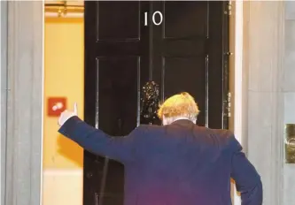  ?? AP-Yonhap ?? British Prime Minister Boris Johnson gives a thumbs-up as he arrives back at 10 Downing Street from the Houses of Parliament in London, Tuesday. Britons will be heading out to vote in the dark days of December after the House of Commons backed an early national vote that could break the country’s political impasse over Brexit — or turn out to be merely a temporary distractio­n.