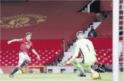  ?? (photo: AFP) ?? Manchester United’s Welsh midfielder Daniel James (left) shoots to score their fifth goal past Leeds United’s French goalkeeper Illan Meslier during the English Premier League football match at Old Trafford in Manchester, north-west England, yesterday.