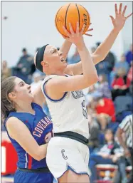  ?? [BRYAN TERRY/ THE OKLAHOMAN] ?? Christian Heritage Academy's Rylee Langerman goes past Southwest Covenant's Autumn Smith during Friday night's game in Del City. Langerman scored 30 points in CHA's 60-36 win.