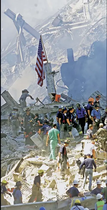  ??  ?? The Stars and Stripes flag amid the rubble; people run from explosions; a firefighte­r at the scene; burned cars at the World Trade Center