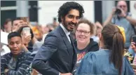  ?? CHRIS HELGREN / REUTERS ?? Actor Dev Patel meets with fans as he arrives for the world premiere of Hotel Mumbai at the Toronto Internatio­nal Film Festival in Canada.